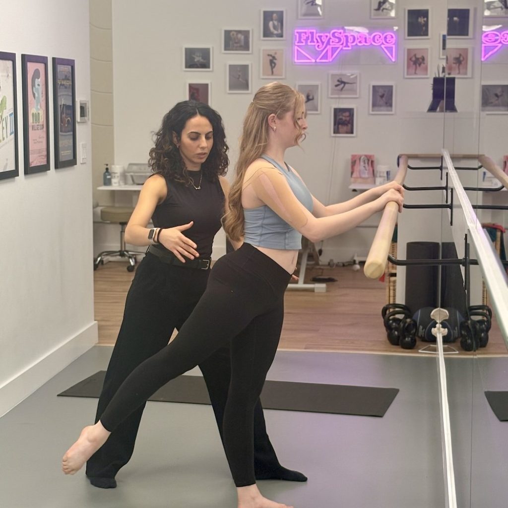 Ami Kirollos working with student Joy Ferguson. Photo by Kelsey McDonald.